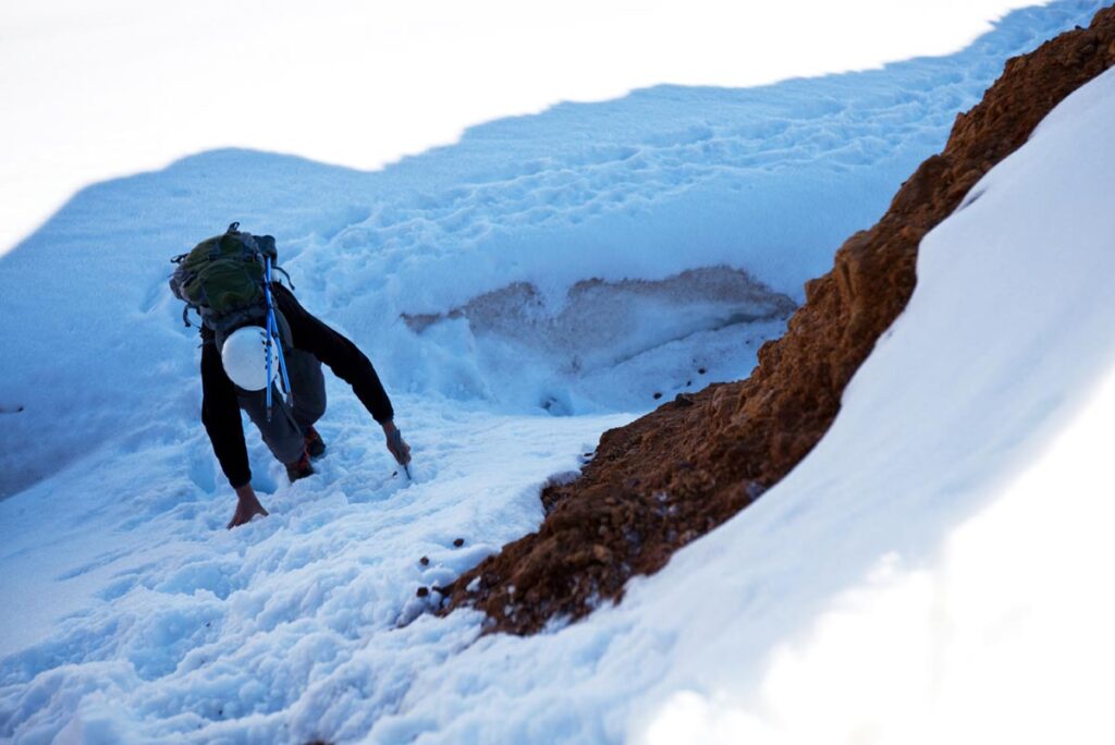 Mountain climber, hiking up Mt. Shasta in the snow