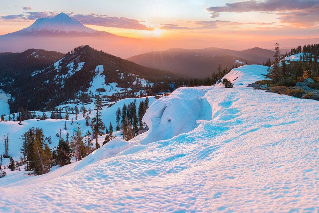 Beautiful view of Mt. Shasta showing hiking trails, covered in snow